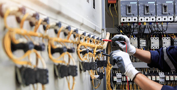 Professional Electrician technician working in Central City, IA